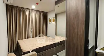 Modern bedroom with elegant decor and large mirror wardrobe