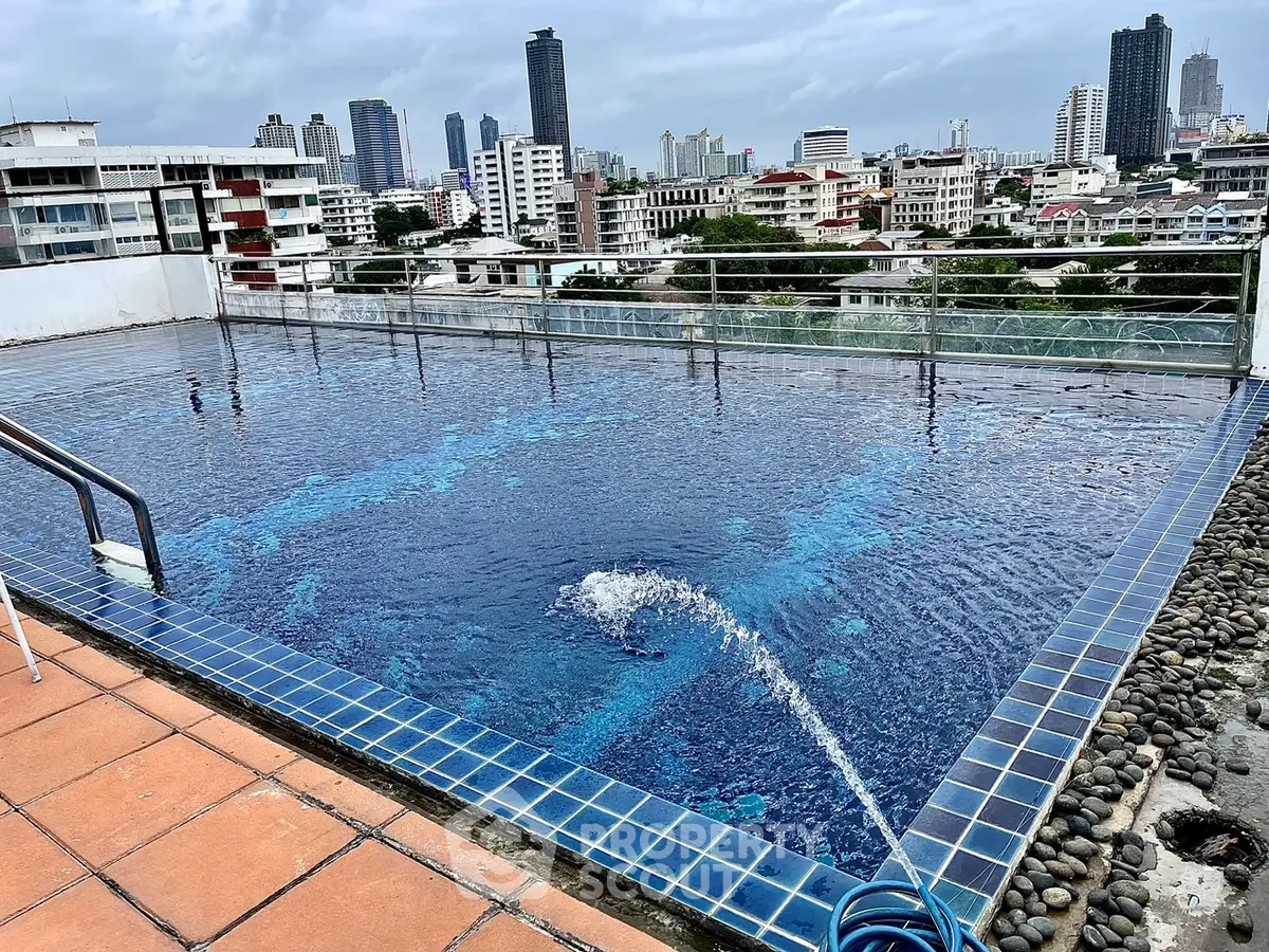 Stunning rooftop pool with panoramic city views, perfect for relaxation and entertainment.