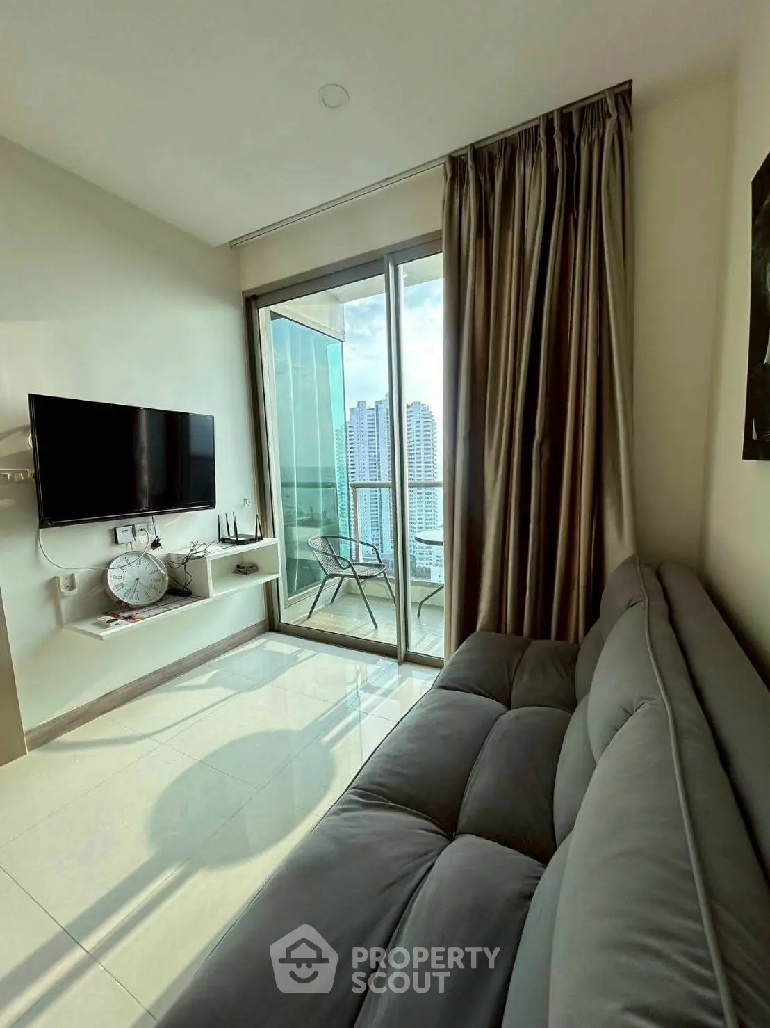 Modern living room with balcony view in high-rise apartment
