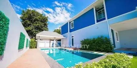 Stunning modern home with private pool and lush greenery, perfect for luxury living.