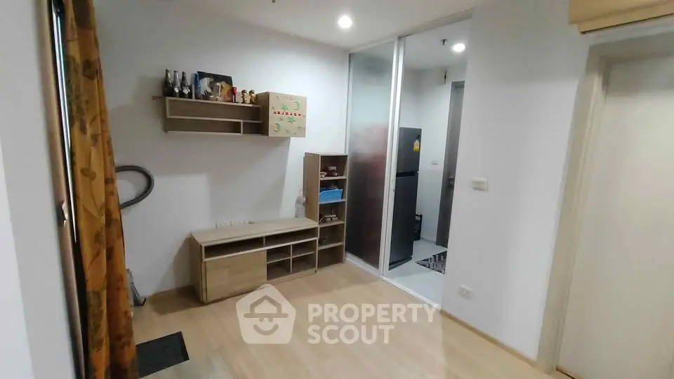 Modern apartment interior with wooden flooring and open kitchen layout
