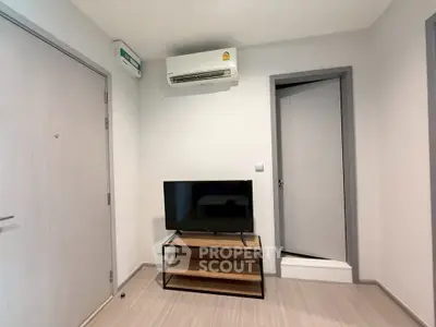 Modern minimalist living room with air conditioning and TV setup