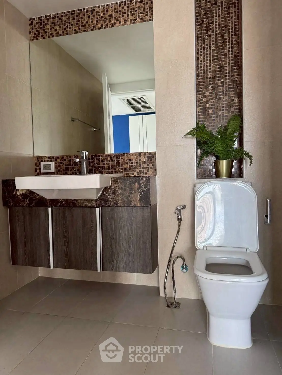 Modern bathroom with stylish mosaic tiles and sleek fixtures