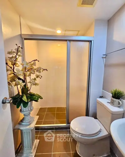 Modern bathroom with shower and elegant decor in a stylish home.