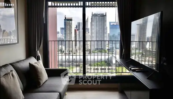 Modern living room with city view, sleek furniture, and large TV.