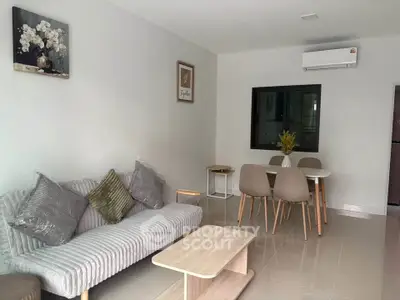Modern living room with stylish furniture and air conditioning in a cozy apartment.