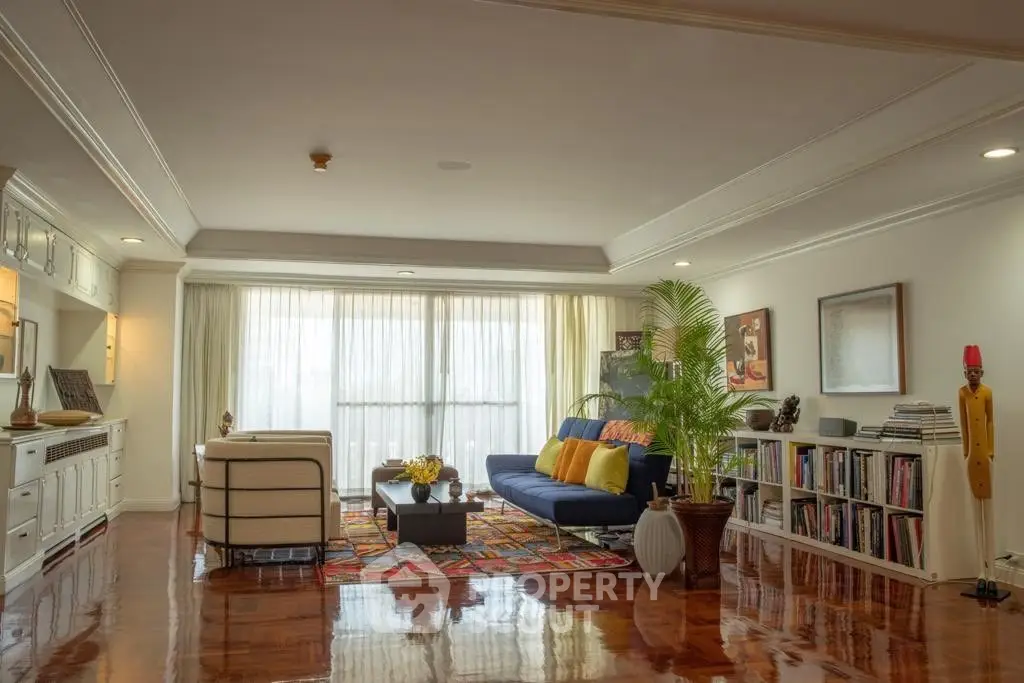 Spacious living room with elegant decor and large windows for natural light.