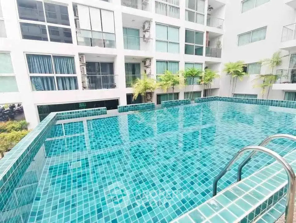 Luxurious apartment complex with a stunning rooftop pool and modern design.