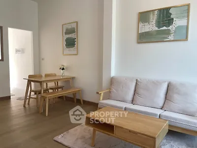 Modern living room with minimalist wooden furniture and stylish decor