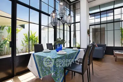 Stunning modern dining area with floor-to-ceiling windows and elegant decor