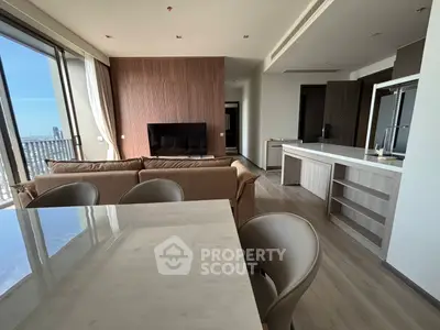 Luxurious modern living room with open kitchen and stunning city view