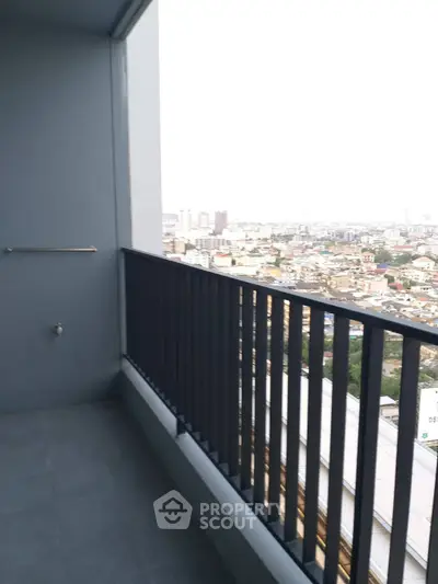 Spacious balcony with stunning city view, perfect for relaxation and enjoying the skyline.