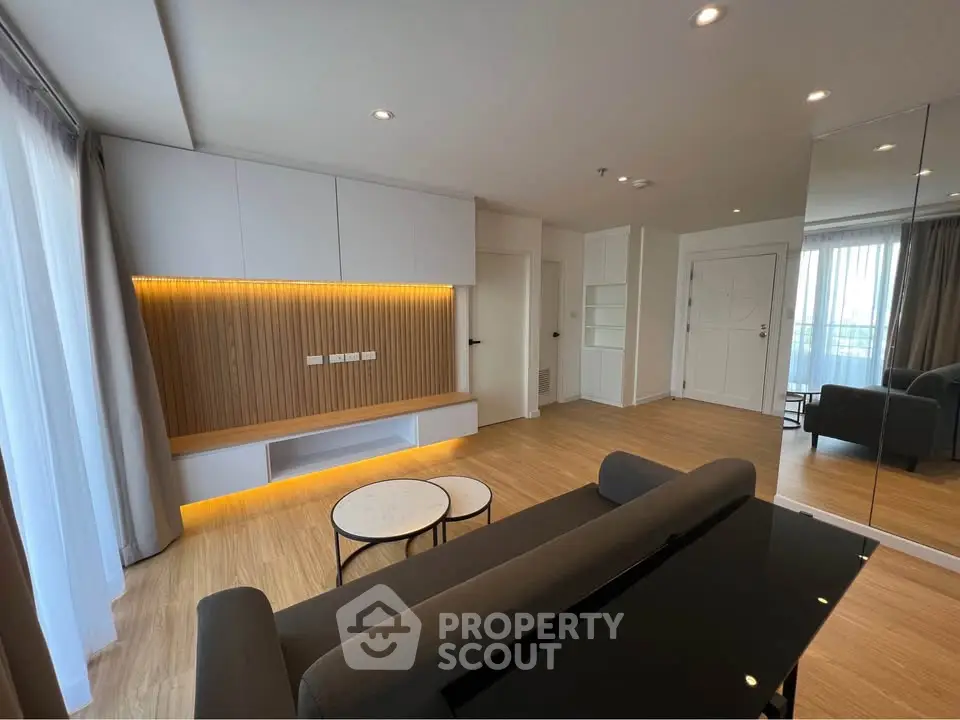 Modern living room with sleek design and ambient lighting