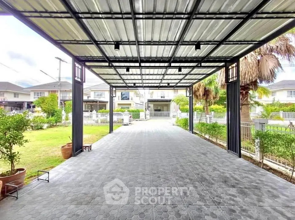 Spacious covered driveway with modern design in suburban neighborhood