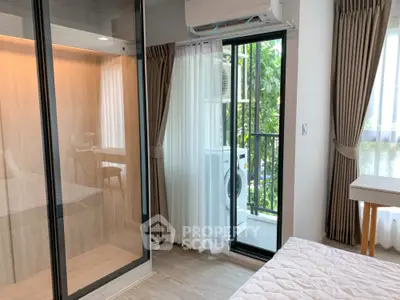 Modern bedroom with balcony and washing machine, featuring sleek design and natural light.