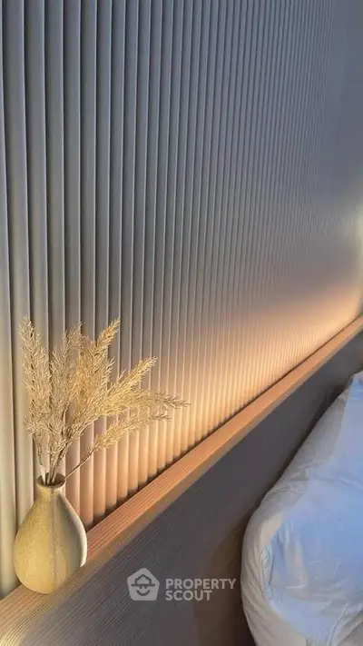 Elegant bedroom with modern textured wall and soft lighting