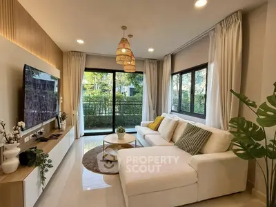 Modern living room with large windows and stylish decor