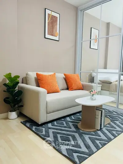 Modern living room with stylish decor and cozy seating in a contemporary apartment.