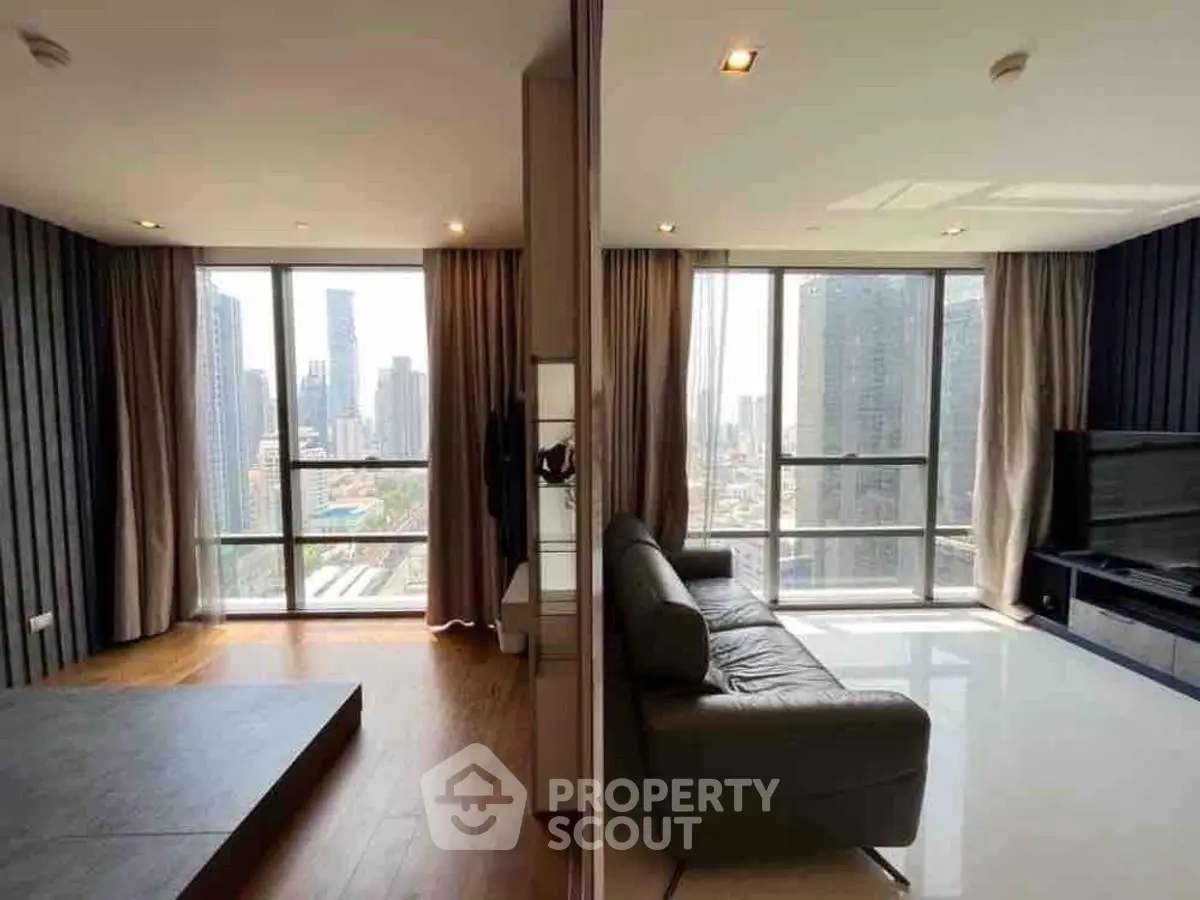 Spacious modern living room with stunning city view and elegant decor