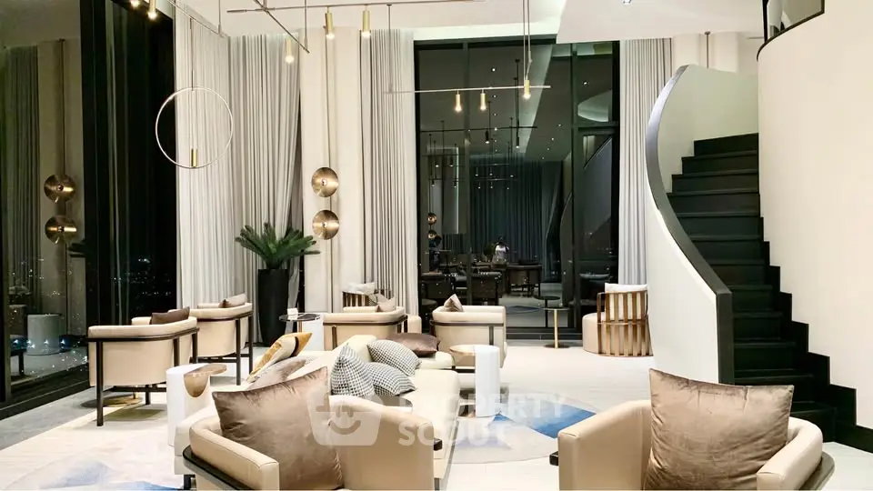 Luxurious modern living room with high ceilings and elegant decor in a high-rise apartment.
