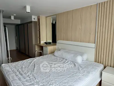 Modern bedroom with wooden accents and spacious wardrobe