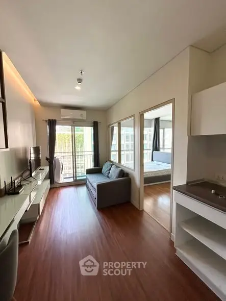 Modern apartment living room with balcony and natural light
