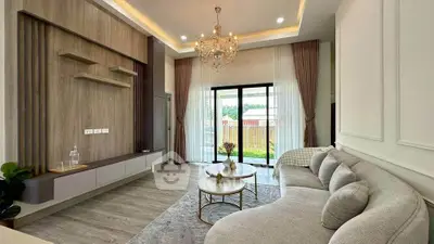 Elegant living room with modern decor and large windows for natural light.