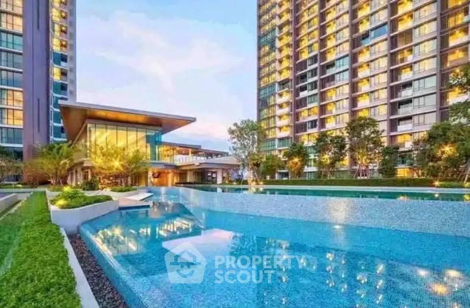 Luxurious condominium with stunning pool and modern architecture, perfect for urban living.
