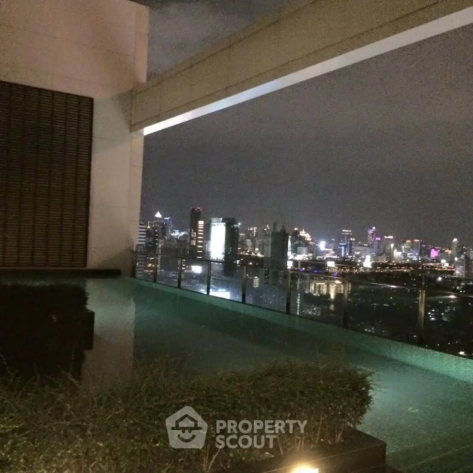 Stunning rooftop view of city skyline from modern building with pool