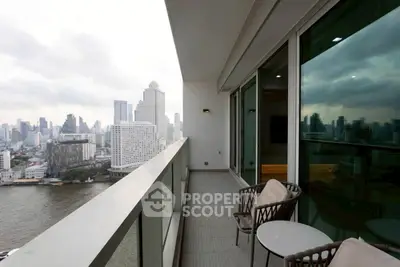 Stunning high-rise balcony with breathtaking city and river views, perfect for urban living.