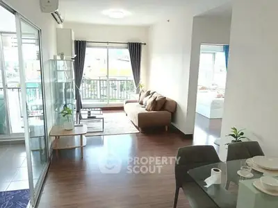 Bright and airy living room with modern decor and balcony access