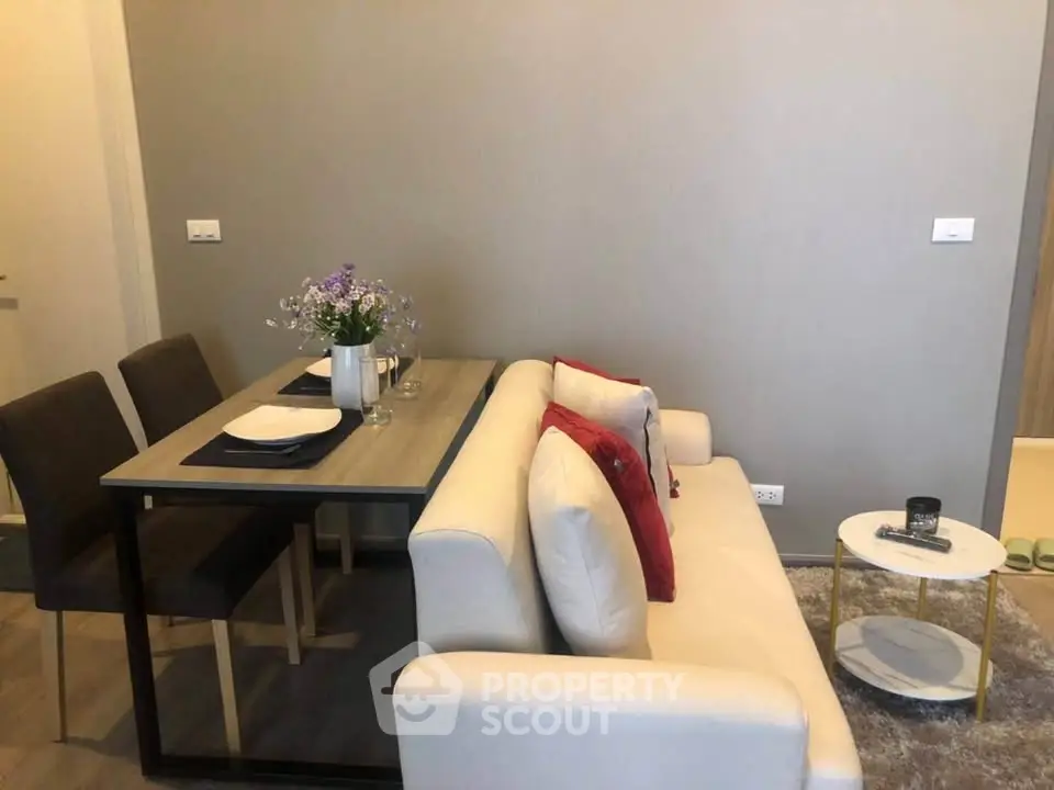 Modern living room with cozy sofa and dining area in stylish apartment