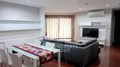 Spacious modern living room with sleek furniture and natural light