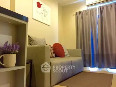 Cozy living room with modern sofa and stylish decor, perfect for relaxation.