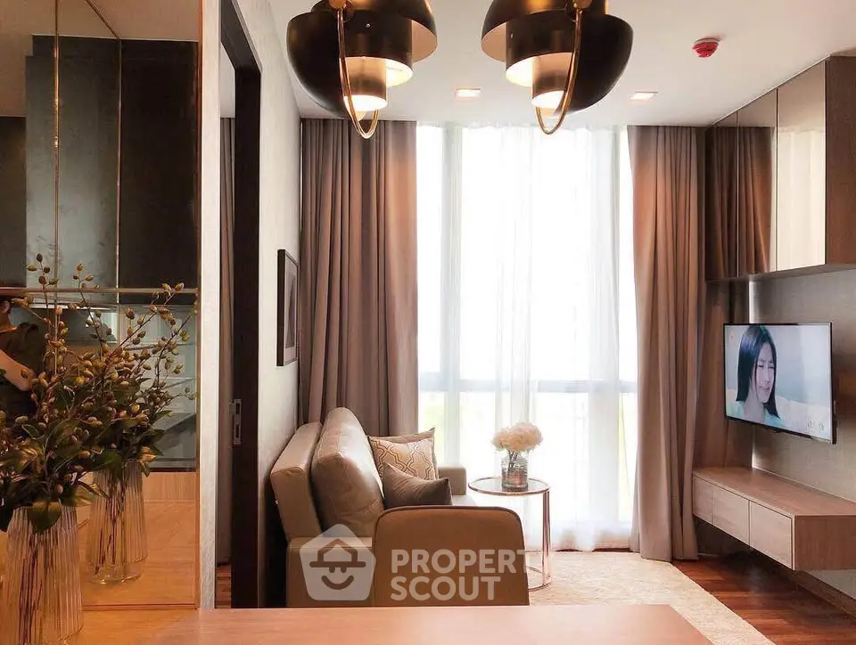 Stylish modern living room with elegant lighting and cozy seating area.