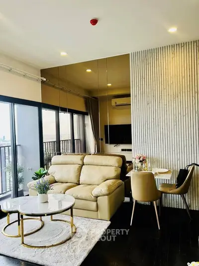 Luxurious living room with modern decor and balcony view in high-rise apartment