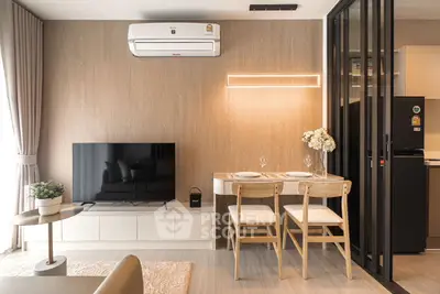 Modern living room with dining area and sleek kitchen design