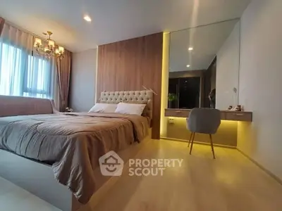 Luxurious bedroom with elegant decor and ambient lighting, featuring a plush bed and stylish vanity area.