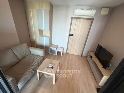 Cozy living room with modern furniture and air conditioning in a stylish apartment.