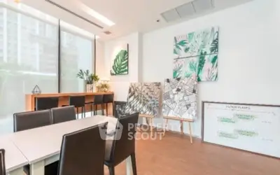Modern study room with stylish decor and large windows in urban apartment