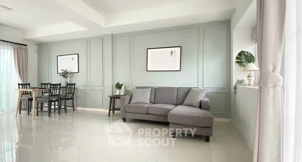 Spacious modern living room with elegant decor and dining area