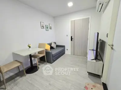 Modern living room with minimalist decor and cozy seating area