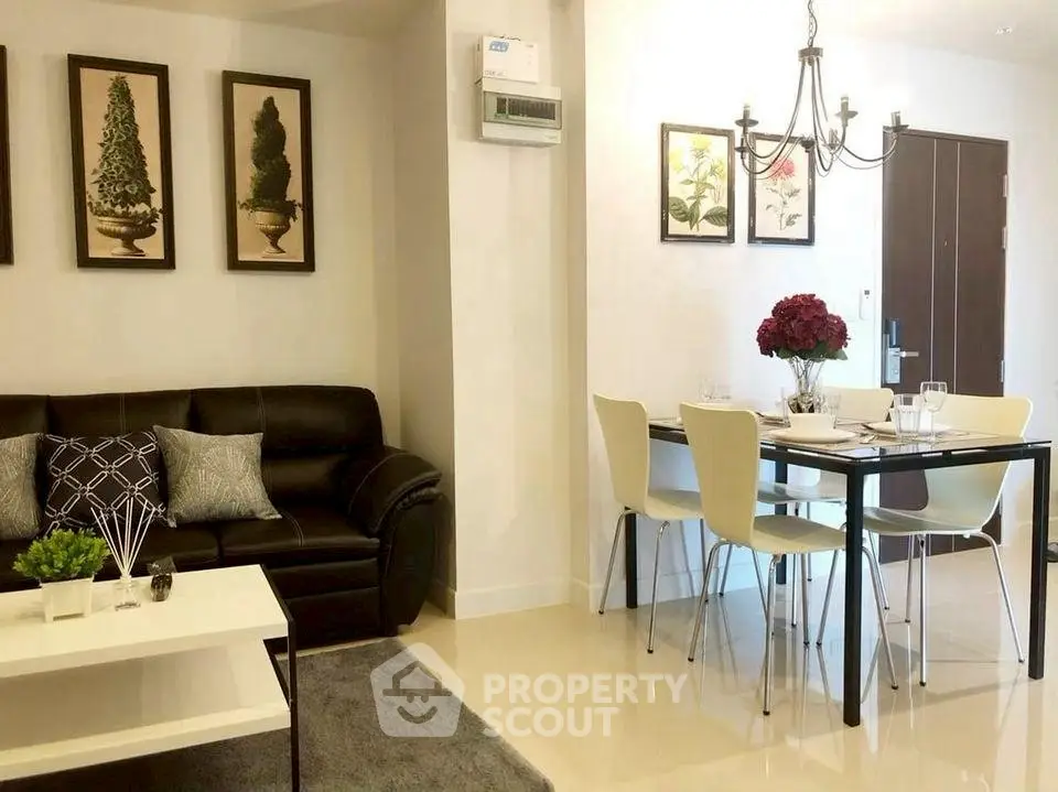 Modern living and dining area with stylish decor and elegant lighting