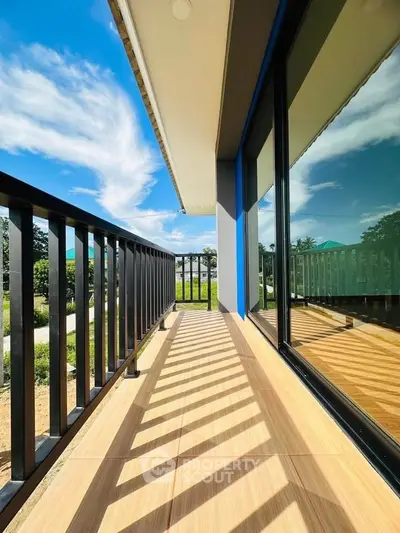 Stunning balcony with modern railing and scenic view, perfect for relaxation.