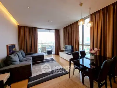 Spacious living room with modern decor and city view, perfect for urban living.