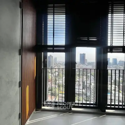 Stunning city view from modern high-rise balcony with sleek design and ample natural light.