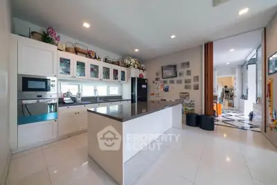 Spacious modern kitchen with sleek island and ample storage