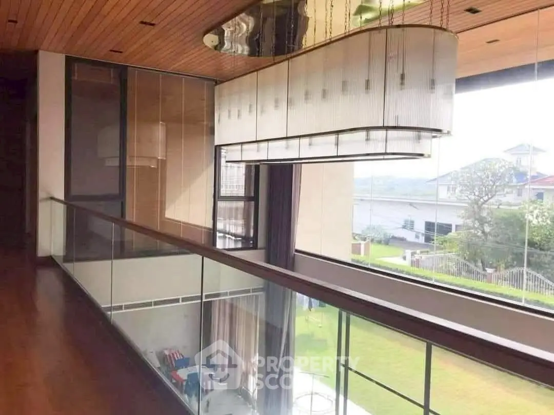 Luxurious modern home with stunning glass balcony and scenic view