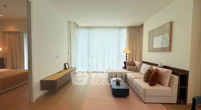 Spacious modern living room with elegant decor and large windows for natural light.