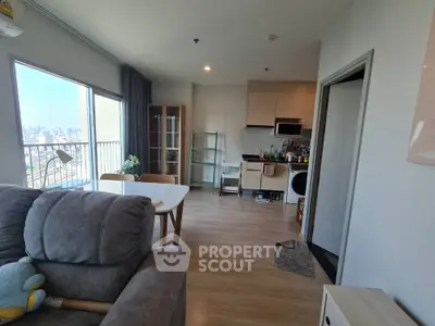 Modern open-plan living room with city view and stylish kitchen area